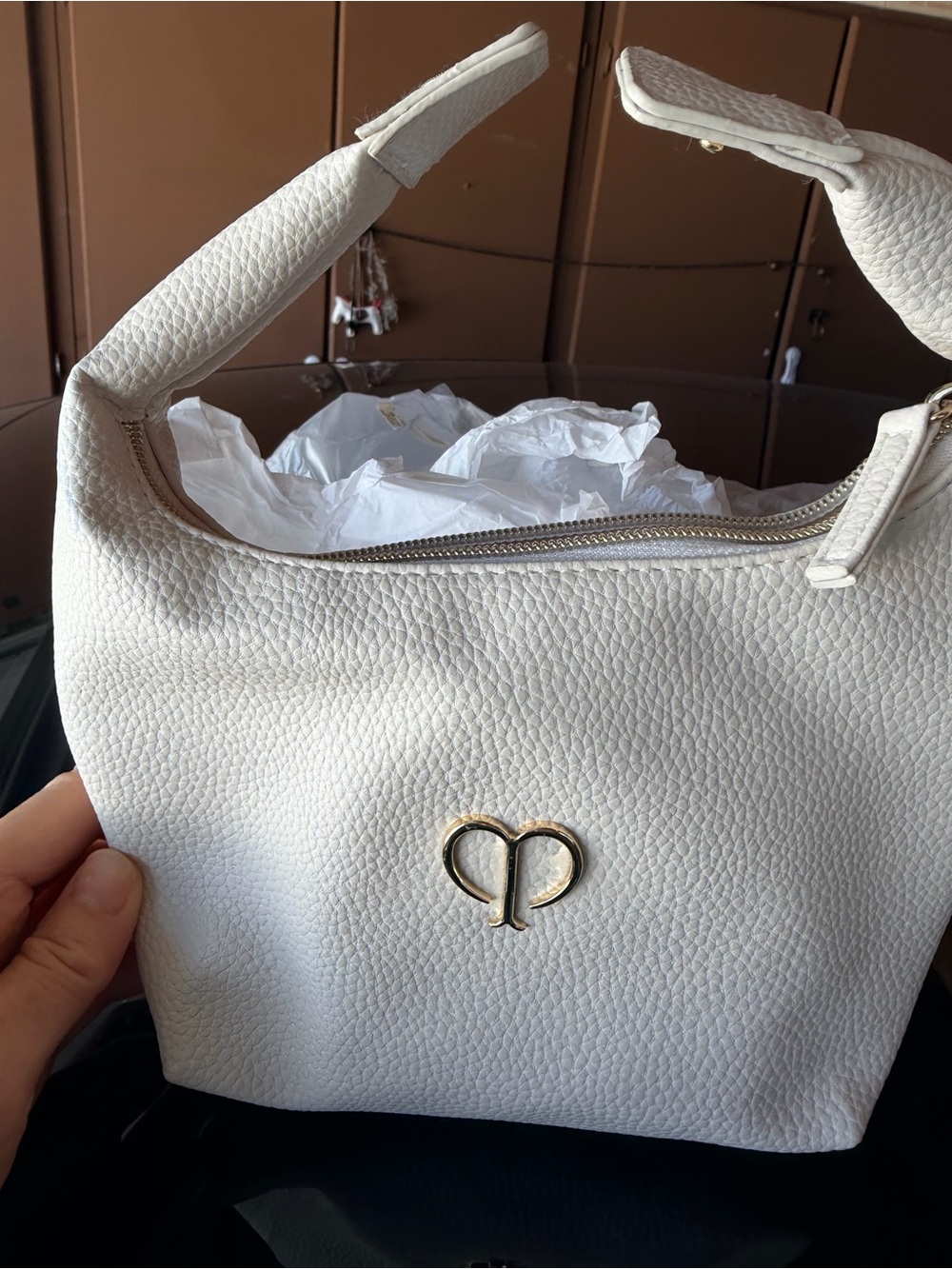 cle de peau White Pebbled Leather Cosmetic Bag with Gold Heart Logo